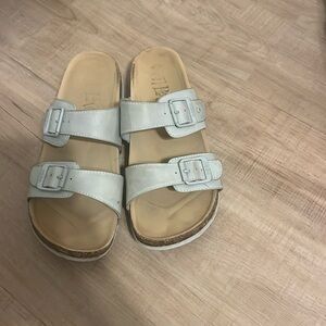 Tan sandals with blue straps